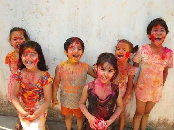 Kids playing holi photos
