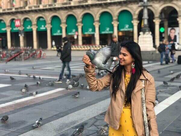 Kavitha Gowda with pigeons having a happy time