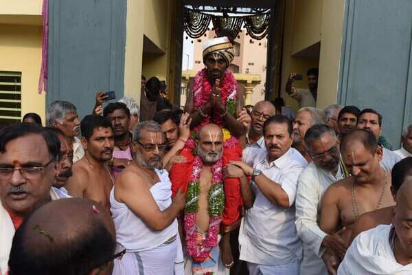 Dalit man carried into temple by priest