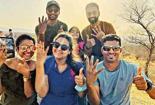 Krishnappa Gowtham and Jayadev Unadkat with their team member and families