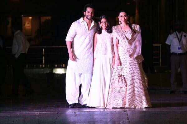 Varun Dhawan and Karisma Kapoor with her daughter