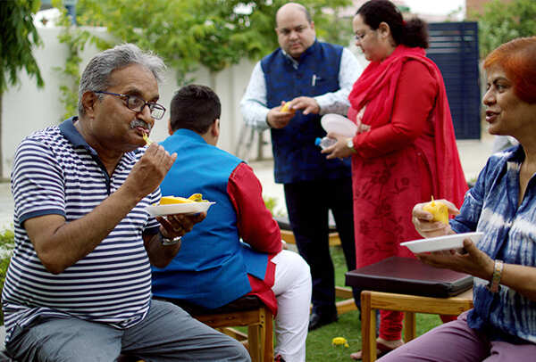People enjoying mangoes before the event (BCCL)