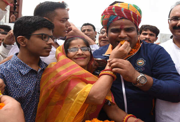 Rajat’s family and friends greet him at the Jaipur airport