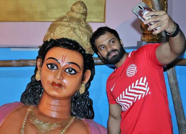a youngster takes a selfie at a mandap