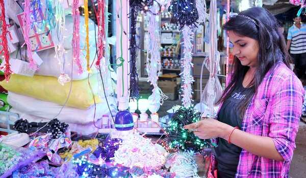 A girl buys decorative lights