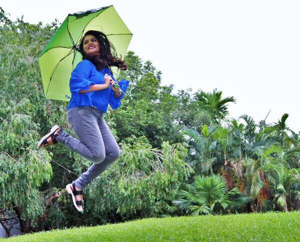 a girl enjoys rain
