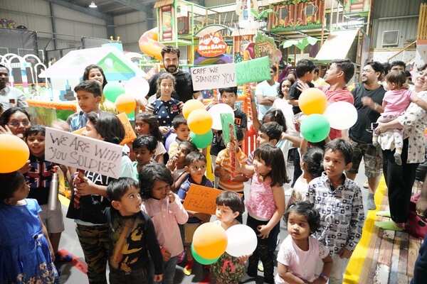 Seen Kids showing placards at Sim and Sam's Party&Plytown Kompally as a part of Play For CRPF program also seen Orgaisers in the pic -2