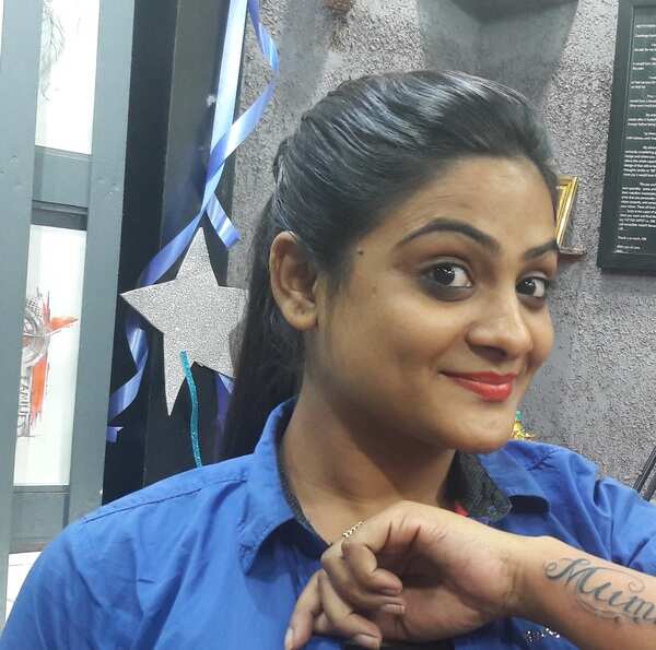 Actress Eli Padhi having a tatto from Omm