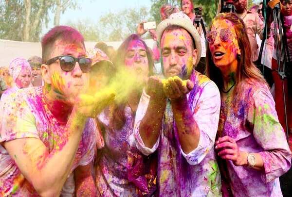 Tourists enjoyed playing Holi at an event organised by the Tourism Department