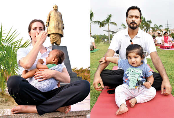 (L) Celeste Evangelina Shrivastava performing anulom vilom with her toddler Eliam Ihan Shrivastava (R) No kidding on International Yoga Day (BCCL/ Farhan Ahmad Siddiqui, Aditya Yadav and Vishnu Jaiswal)