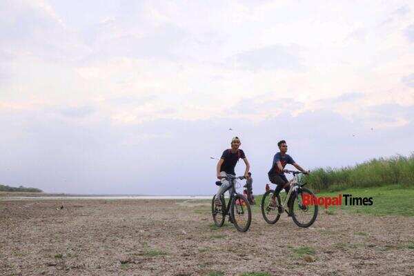People cycling at Bhopal Lake.
