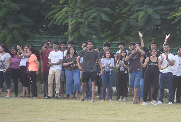 Students cheering for their favourite teams from the stands