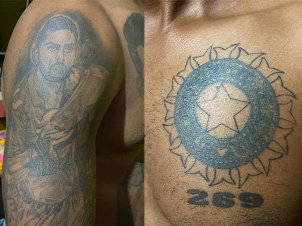 A fan of Indian cricketer Shikhar Dhawan with multiple tattoos of Dhawan on  his body poses ahead of the first one day international cricket match  between India and South Africa, in Lucknow,