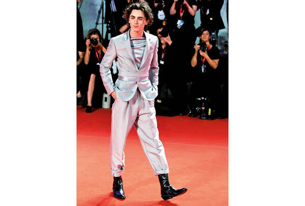 Timothée Chalamet set tongues wagging in his silver suit with turn-ups at the Venice Film festival in September