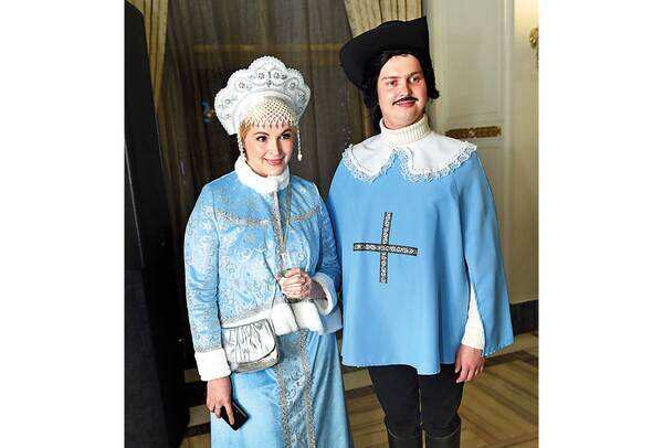 Elena Nikolicheva, Second Secretary, Russian embassy, dressed as the granddaughter of Father Frost, Russia’s Santa Claus, and Gleb Gil, Attache, Russian embassy, dressed as a French musketeer