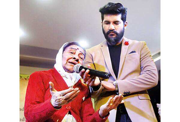 Vijay Yesudas (right), KJ Yesudas’s son, with Leela Omcherry