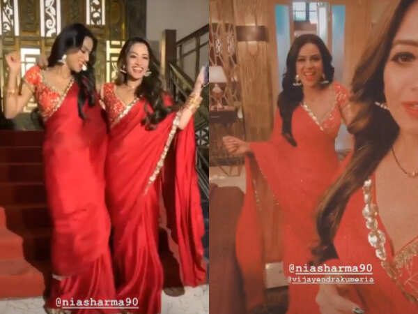 Nia and Anita twin in a red saree