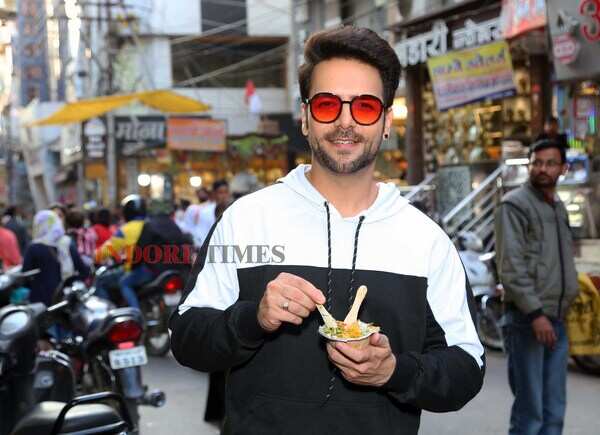 Trying out street food at Rajwada. He liked the bhutte ka kees