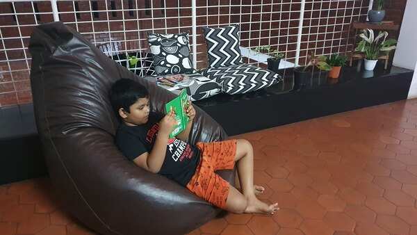 Advik R Krishna reading story books