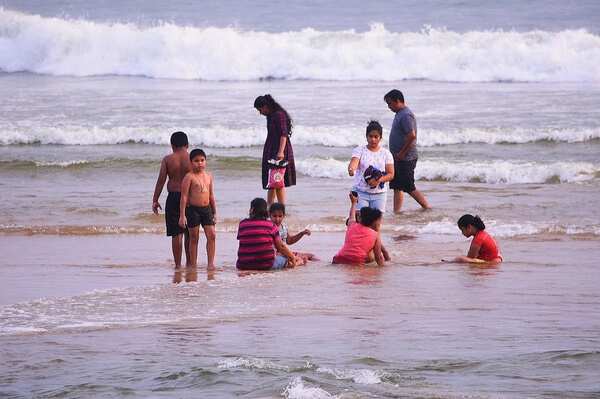 Locals visit Baga beach for their salt water bath