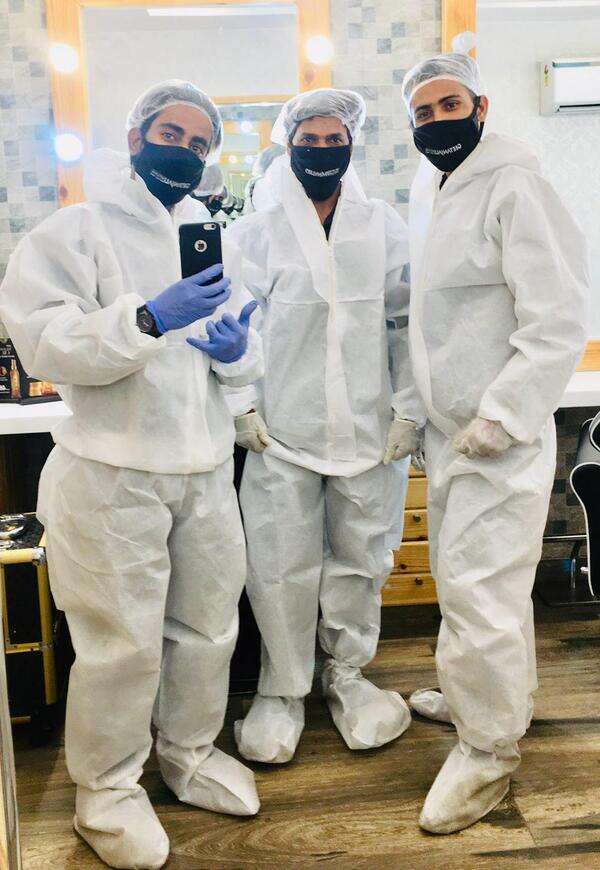 Salon staff in PPE kits