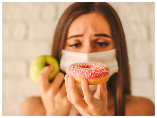 How to eat food while wearing a mask? - Times of India