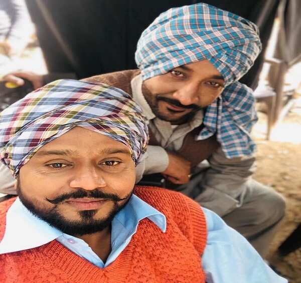 Shera with Karamjit Anmol (in front)