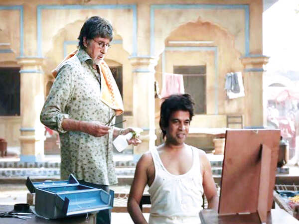 Ishtiyak Khan with Amitabh Bachchan in an ad (BCCL)