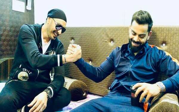 Sukhbir with cricketer Virat Kohli