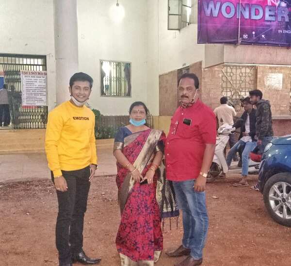 Swaraj and his family near a cinema hall - Copy.