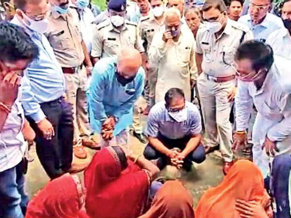 Ujjain collector Asheesh Singh and other officials meet relatives of the victims