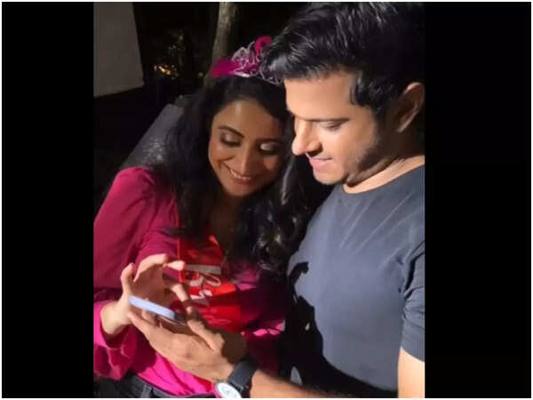 Aishwarya showing the pictures and videos of her bachelorette to Neil