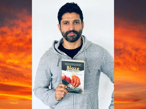 Actor Farhan Akhtar with a copy of 'Blaze'