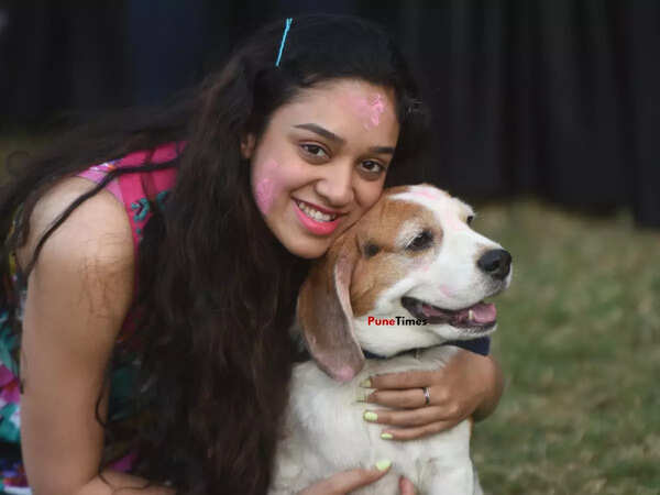 A pet mommy poses with her dog