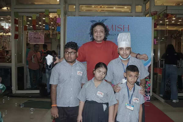 Tanmoy Bose posing with specially abled children 2 online