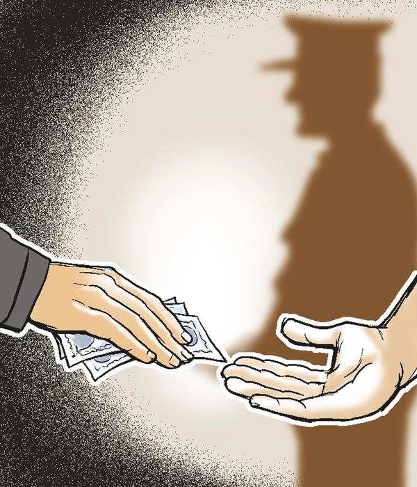 PSI, his aide caught taking 1.3 lakh bribe