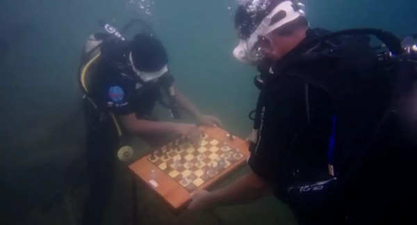 Black and white - Underwater chess in Chennai: Scuba divers play chess  under sea