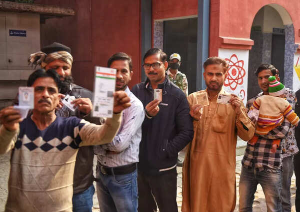 People wait in line for their turn to vote