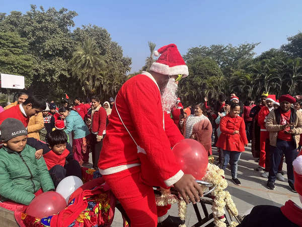 Ho ho ho: Real-life Santas spread Christmas cheer among kids in