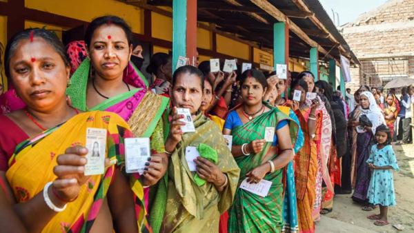 Female voters showing identification cards in North Tripura district
