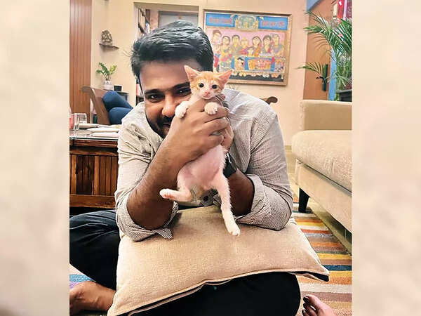 Fahad with Ghalib, a rescued cat that he gave Swara to foster