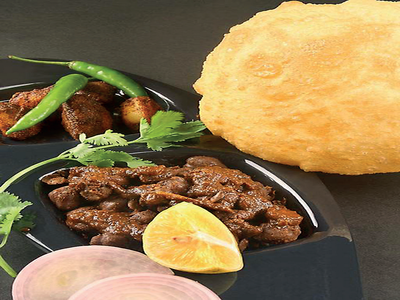 Chickpeas doused in masala and gravy with two hearty pooris – get your fix of chole bhature