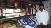 Andhra man sells off house to weave Tricolour without stitches 