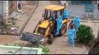 Andhra Pradesh: Vizag civic official uses earthmover to shift body of Covid patient, suspended 