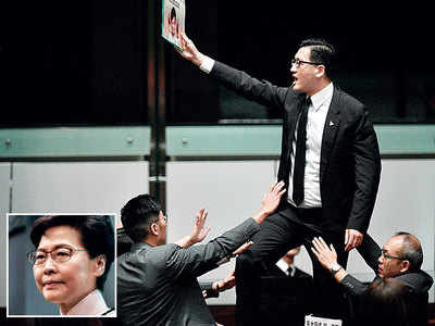 Hong Kong leader heckled in House, abandons speech