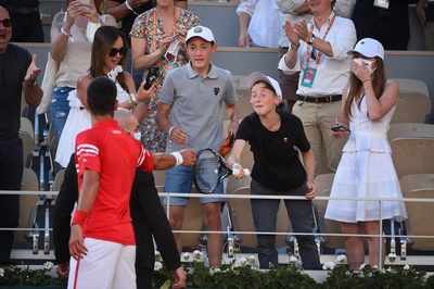 Novak Djokovic gives match-winning racquet to a boy 'with right tactics'
