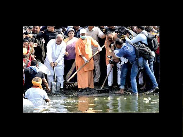 Yogi Adityanath joins sweepers, students to clean Gomti