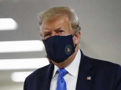 Donald Trump finally dons mask as US sets new virus case record