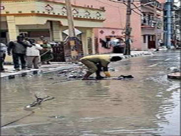 Manhole blocked with football, helmets; sewage overflows