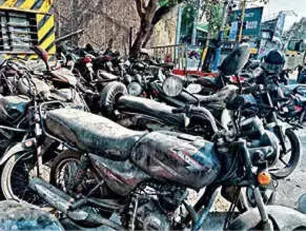 Seized vehicles gather dust, block footpaths